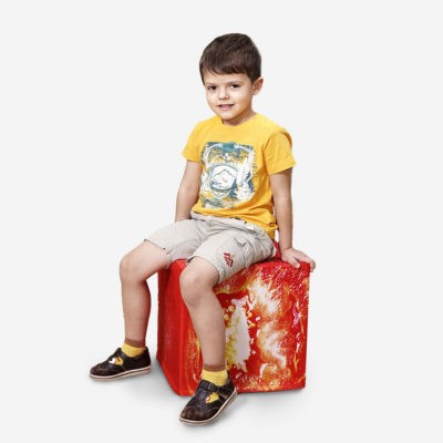 boy is sitting on tomato cube